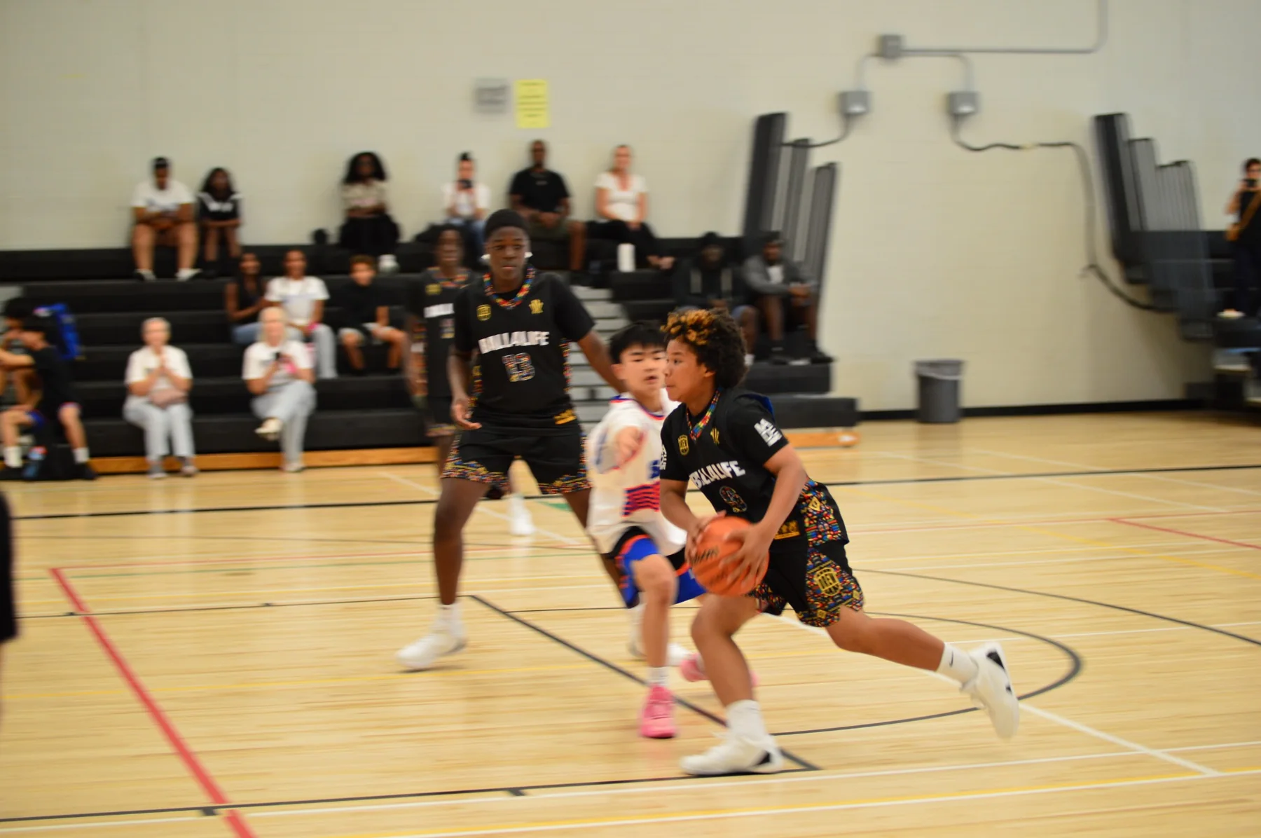 Ball4Life athlete driving through a defender